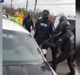 VIDEO. Bărbat scos de mascați din mașina în care se baricadase